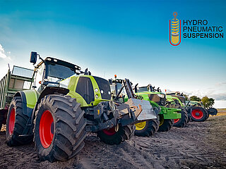 Various tractors in a row demonstrate the many uses of HYDAC suspension systems.
