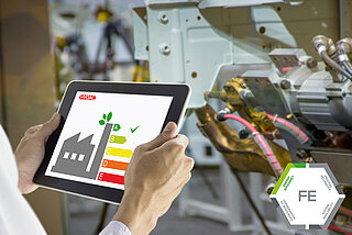Bar chart shown on tablet in the industry including Fluid Engineering logo