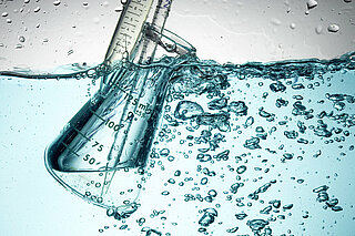 Illustration of process water with pipette and measuring cup.
